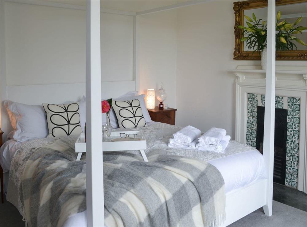 Four poster bedroom at The Old Vicarage in Talland Bay, near Looe, Cornwall