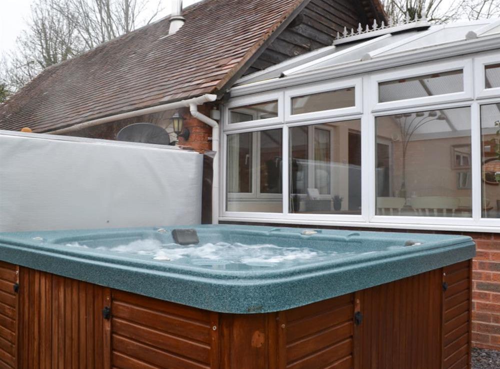 Relax in the private hot tub at The Old Winery Cottage in Newent, Gloucestershire