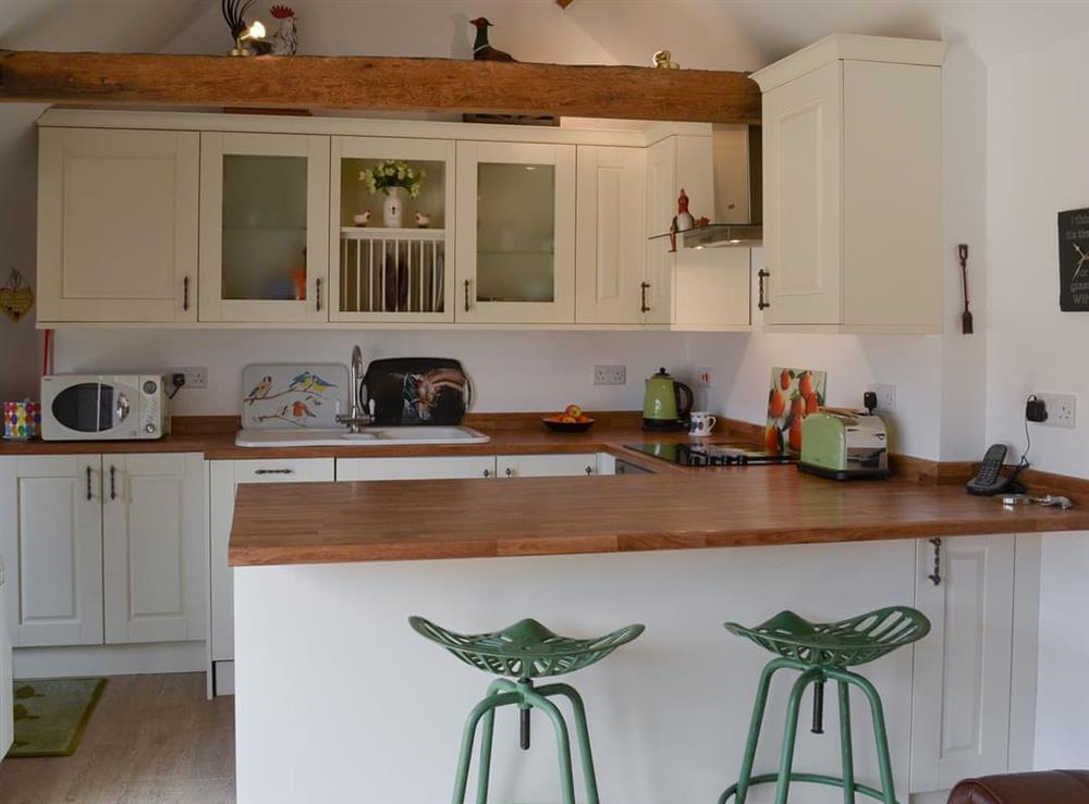 Kitchen with breakfast bar at The Olde Barn in Welton, near Lincoln, Lincolnshire