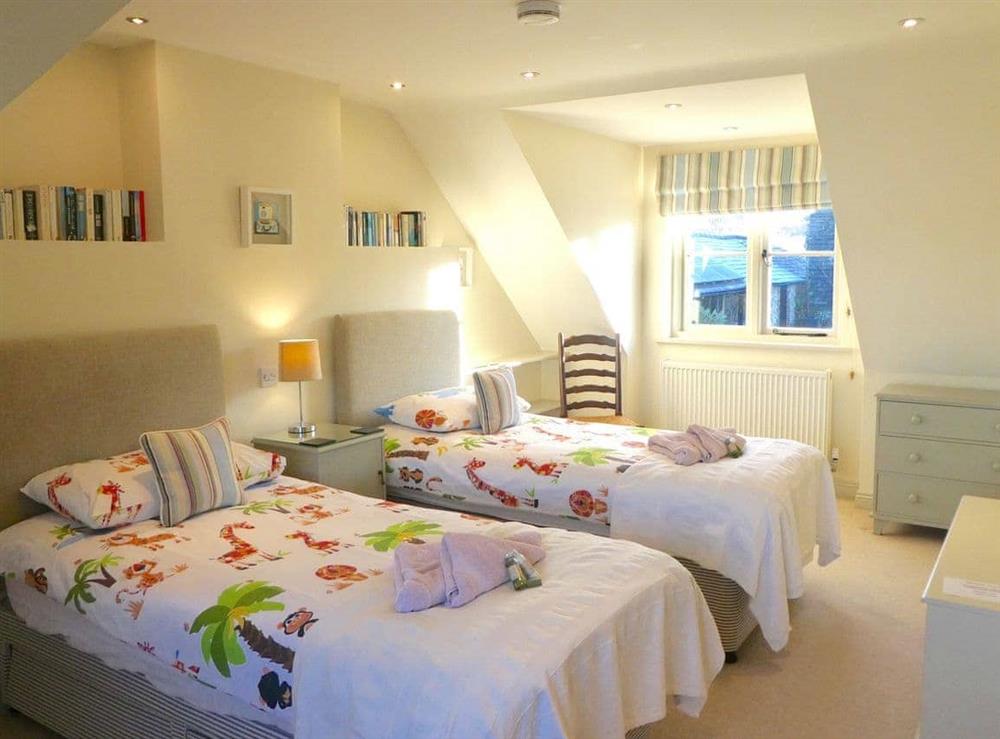 Bedroom with twin single beds at The Owl House in Bishops Waltham, Hampshire