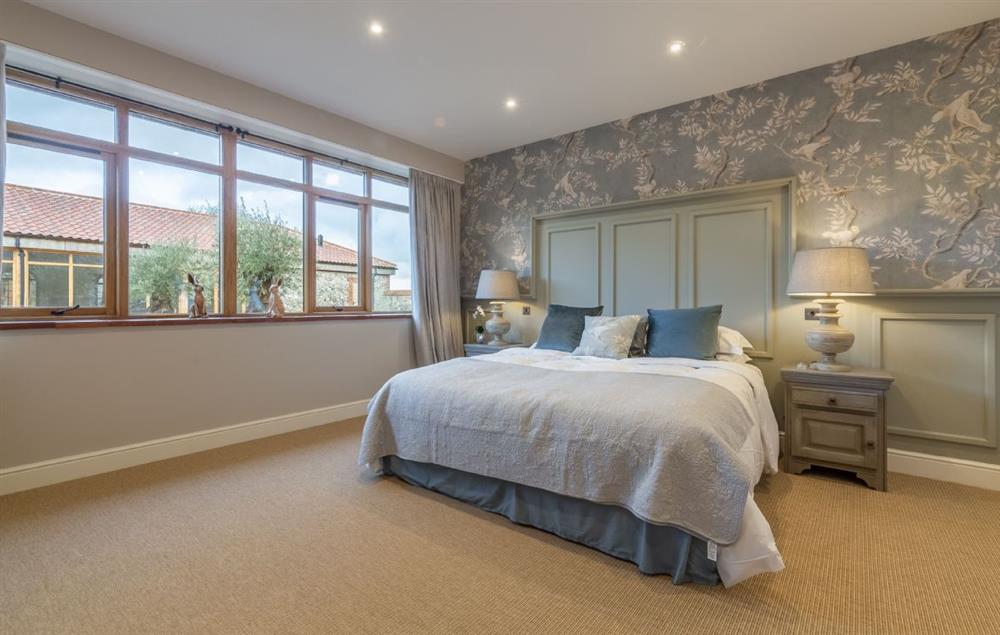 Bedroom with 6’ super king-size zip and link bed with Vi  sprung mattress at The Owl House, Little Massingham