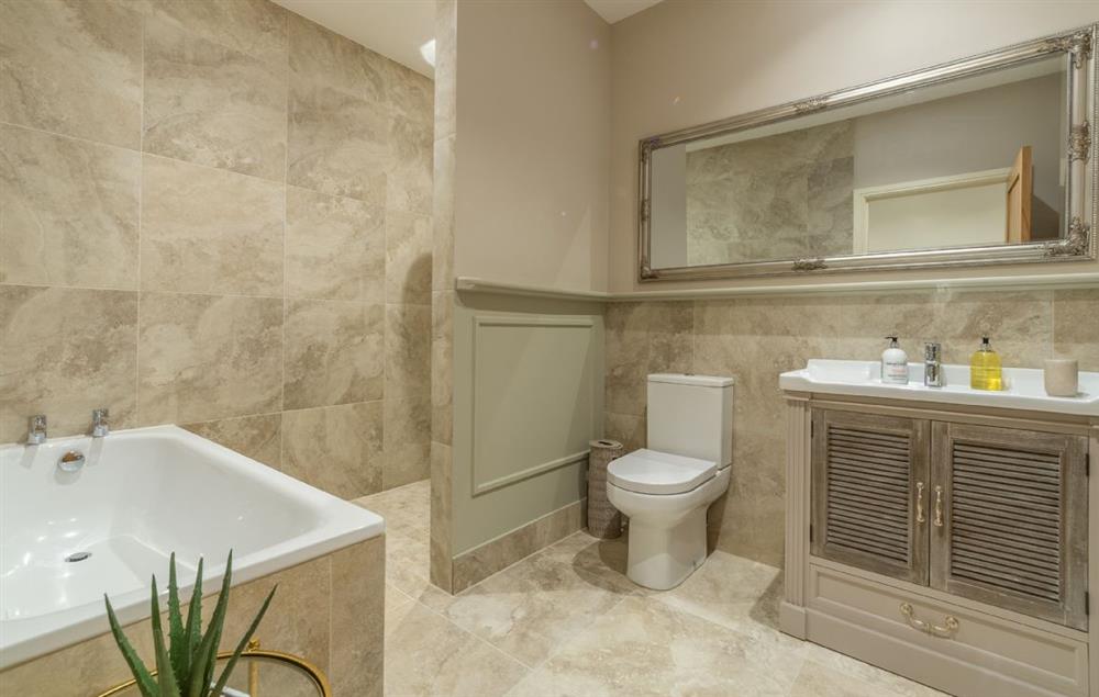 En-suite with bath and deluxe shower at The Owl House, Little Massingham
