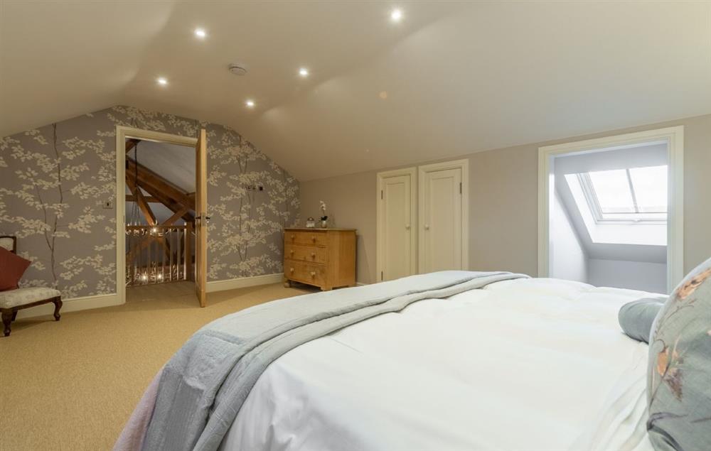 Master bedroom with 6’ super king-size bed with VI sprung mattress (photo 2) at The Owl House, Little Massingham