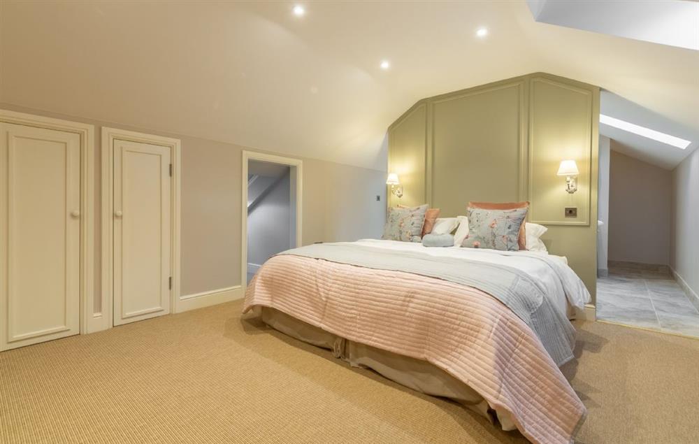 Master bedroom with 6’ super king-size bed with VI sprung mattress at The Owl House, Little Massingham