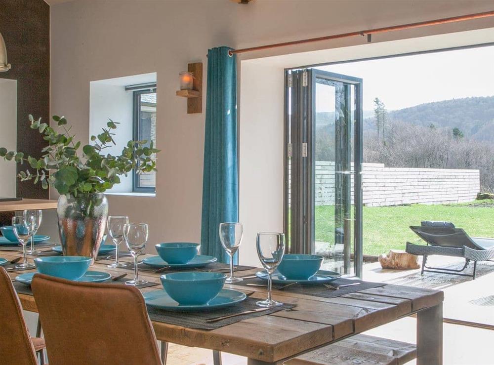 Dining area with spectacular countryside views at The Pendre Longbarn in Pontrhydygroes, near Ystrad Meurig, Cardigan, Dyfed