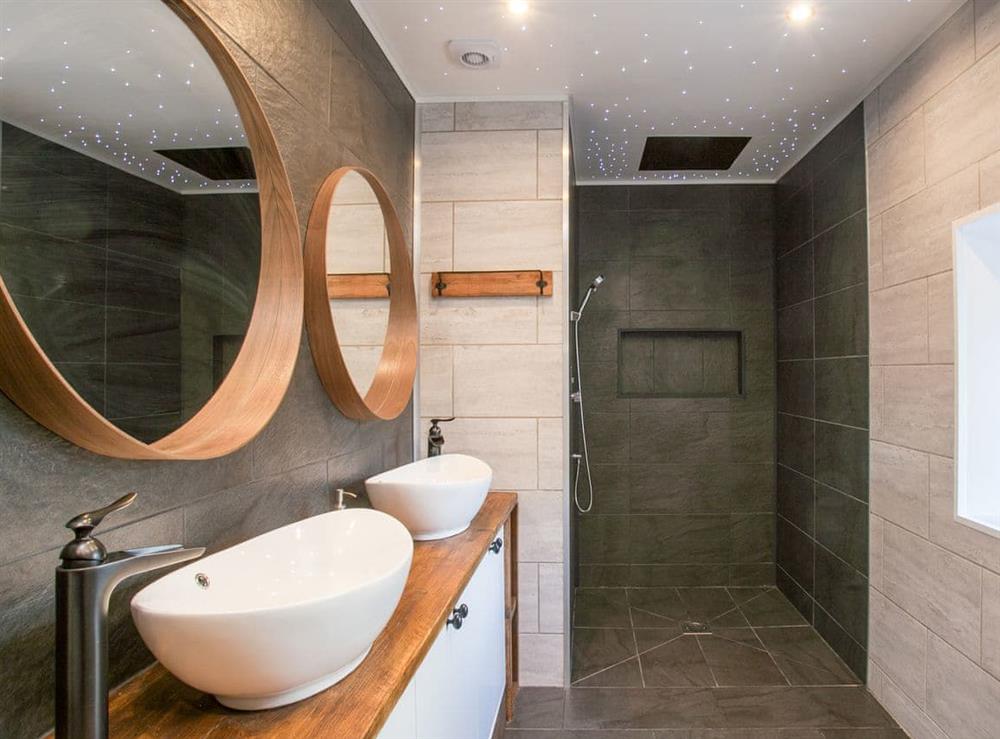 En-suite with wet room style shower and unique lighting