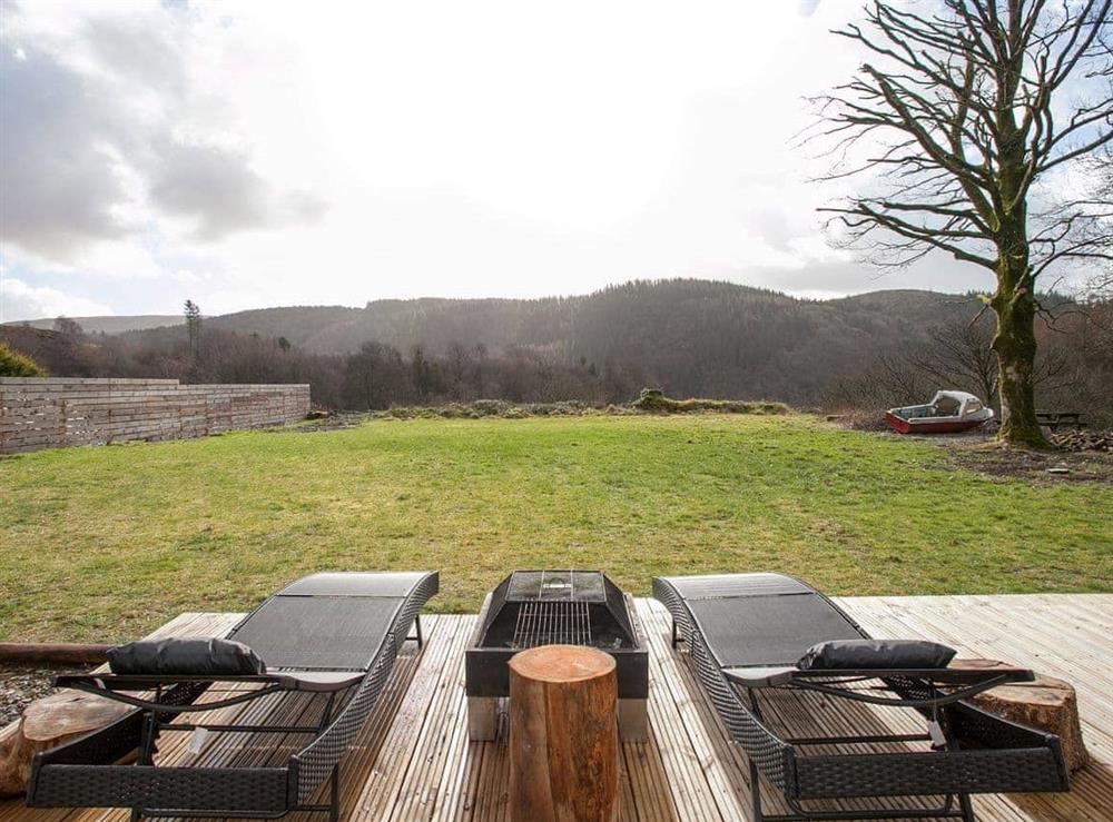 Relax on one of the loungers and admire the view at The Pendre Longbarn in Pontrhydygroes, near Ystrad Meurig, Cardigan, Dyfed