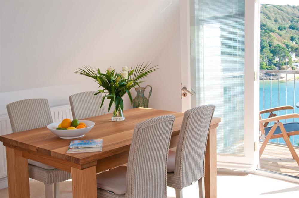 Dining area has oak table and four chairs at The Penthouse (Woodside) in Bennett Road, Salcombe