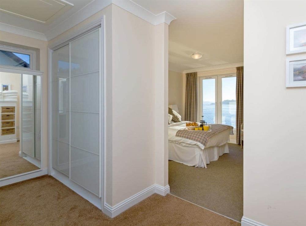 Master bedroom with a separate dressing area at The Penthouse in Strone, near Dunoon, Argyll