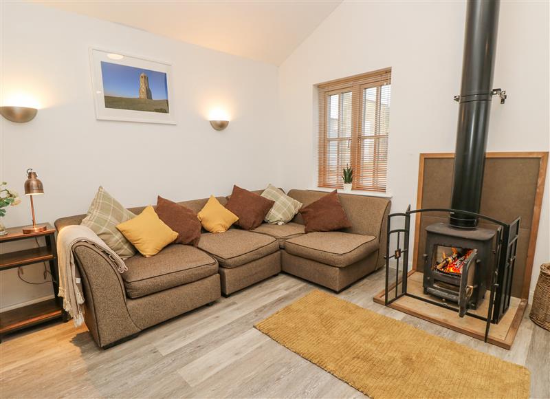 Relax in the living area at The Pepper Pot Retreat, Niton