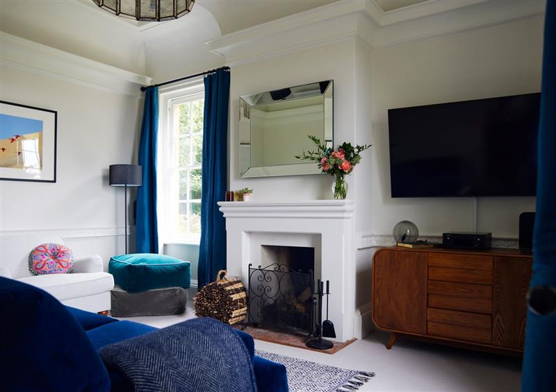 Relax in the living area at The Pheasantry, Goodwood Estate