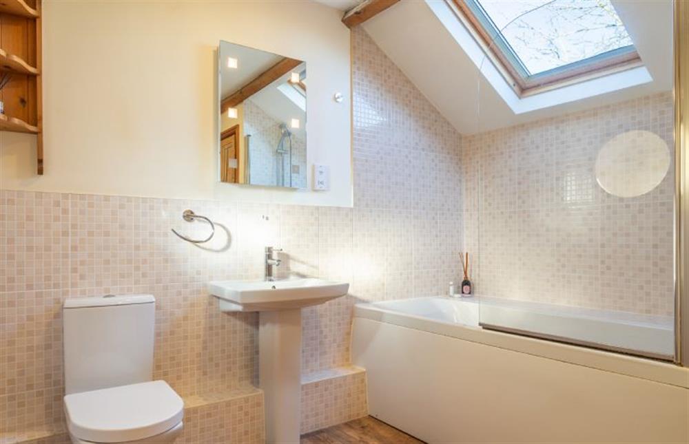 Bathroom with bath with shower over, wash basin and WC at The Piggery, Colne Valley
