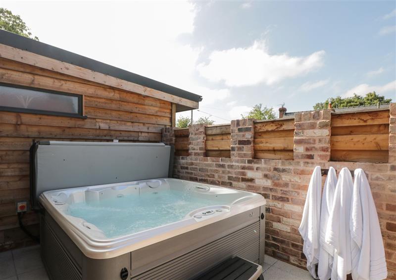 There is a hot tub at The Piggery, Cross Keys near Hereford
