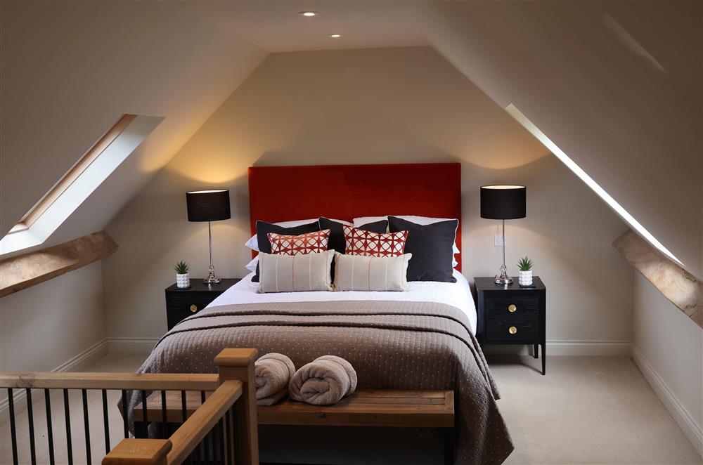 The cosy bedroom with a 5’ king-size bed at The Piggery, Walton, Near Stratford-upon-Avon