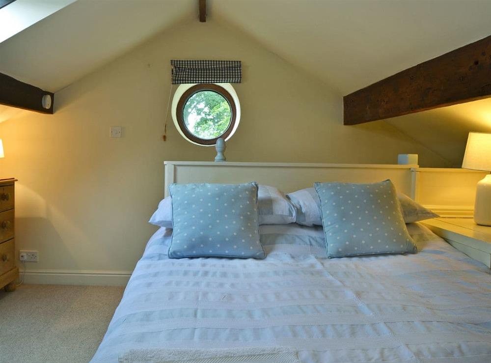 Romantic bedroom with en-suite bathroom at The Pigsty Cottage in Oswestry, Shropshire