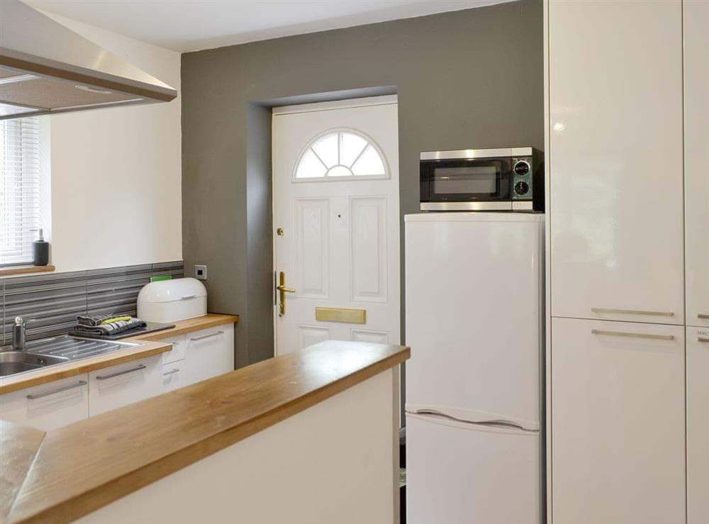 Fully appointed kitchen area at The Pigsty in Llanddeusant, near Holyhead, Anglesey, Gwynedd