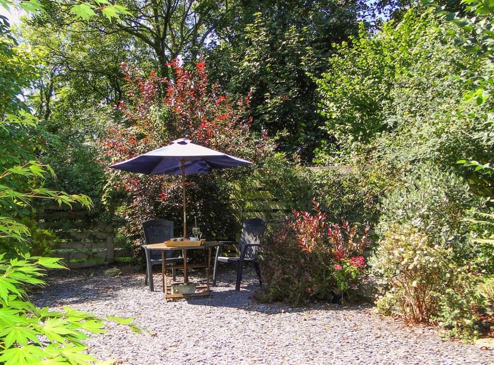 Idyllic patio area within garden at The Pigsty in Llanddeusant, near Holyhead, Anglesey, Gwynedd