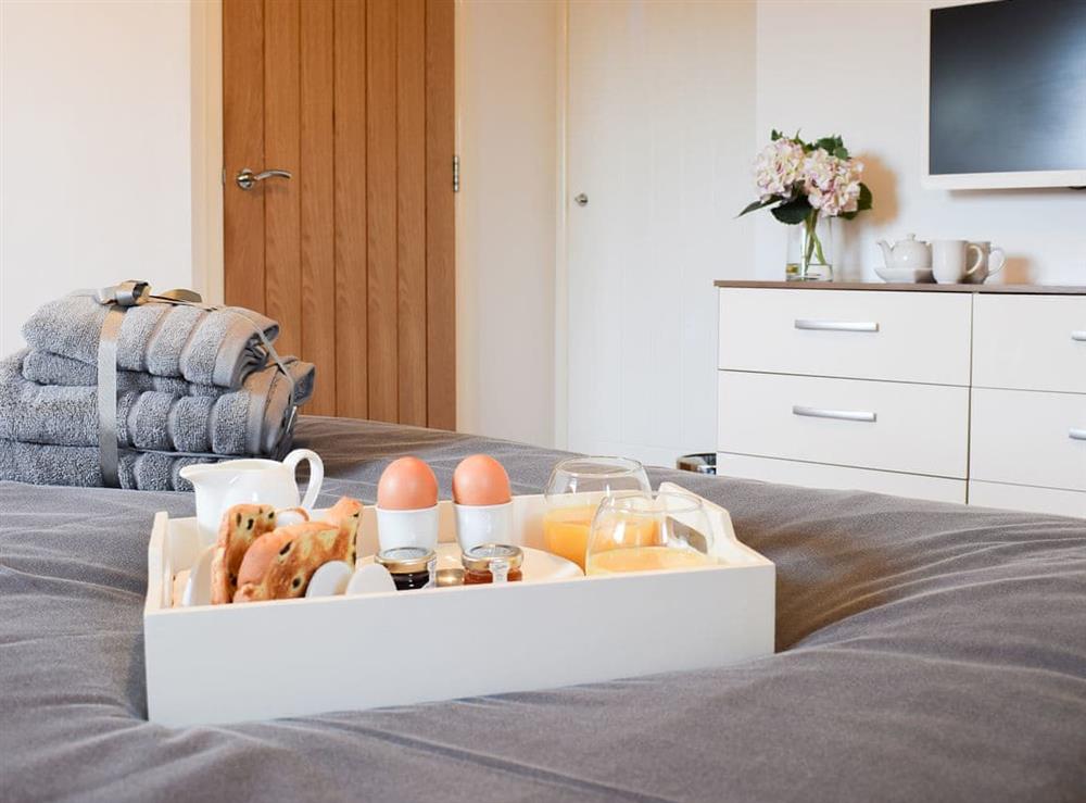 Enjoy a relaxing breakfast in bed at The Plucking Barn in Llanwnnen, near Lampeter, Cardigan, Dyfed