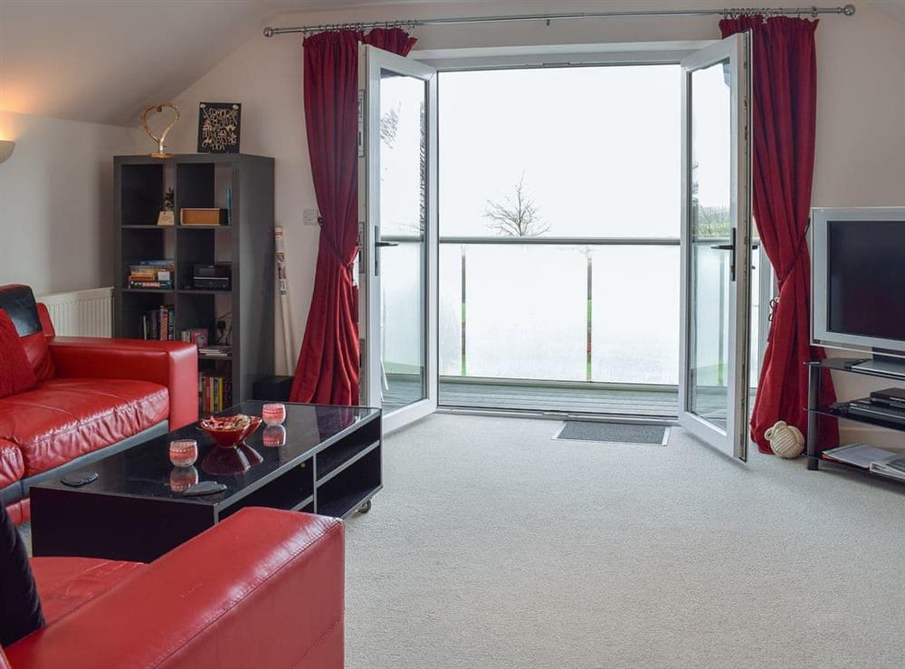 Spacious living area with balcony at The Plucking Barn in Llanwnnen, near Lampeter, Cardigan, Dyfed