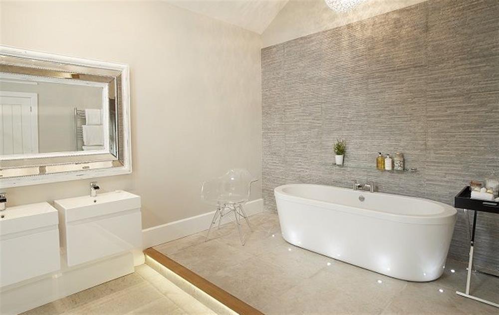 En-suite bathroom with underfloor heating, double sinks and large freestanding bath at The Potting Shed, Weston-under-Lizard, Shifnal 