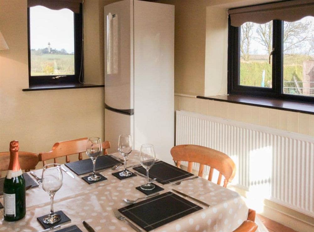 Lovely dining area with views over the surrounding countryside at The Pump House in Hawkesbury Upton, Avon