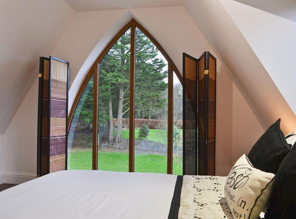 Double bedroom with views of the garden at The Pump House in Old Hunstanton, near Hunstanton, Norfolk