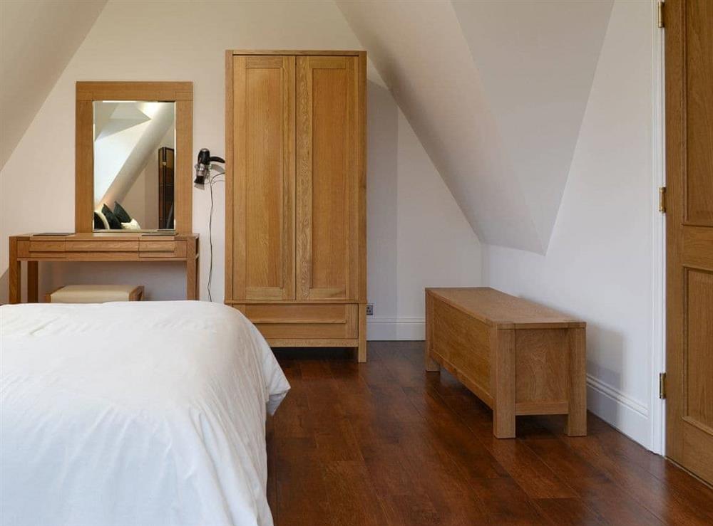 Spacious double bedroom with dressing area at The Pump House in Old Hunstanton, near Hunstanton, Norfolk