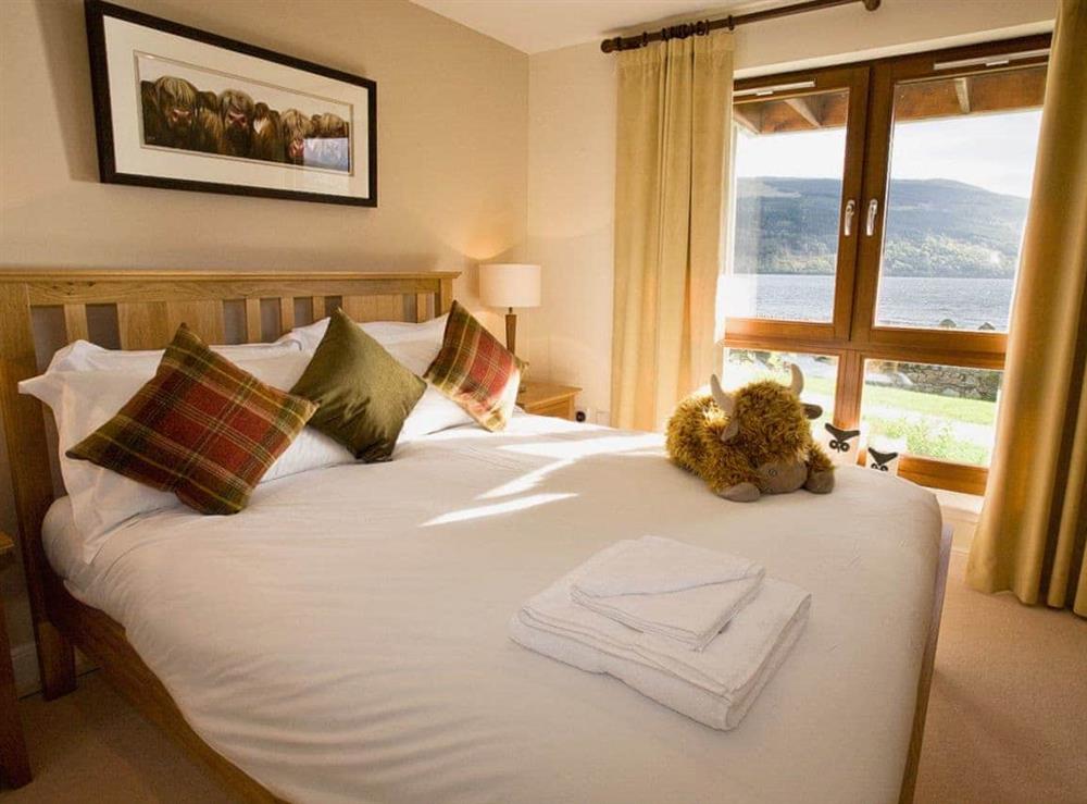 Double bedroom with loch and mountain views at The Quaich in Fearnan, by Aberfeldy, Perthshire
