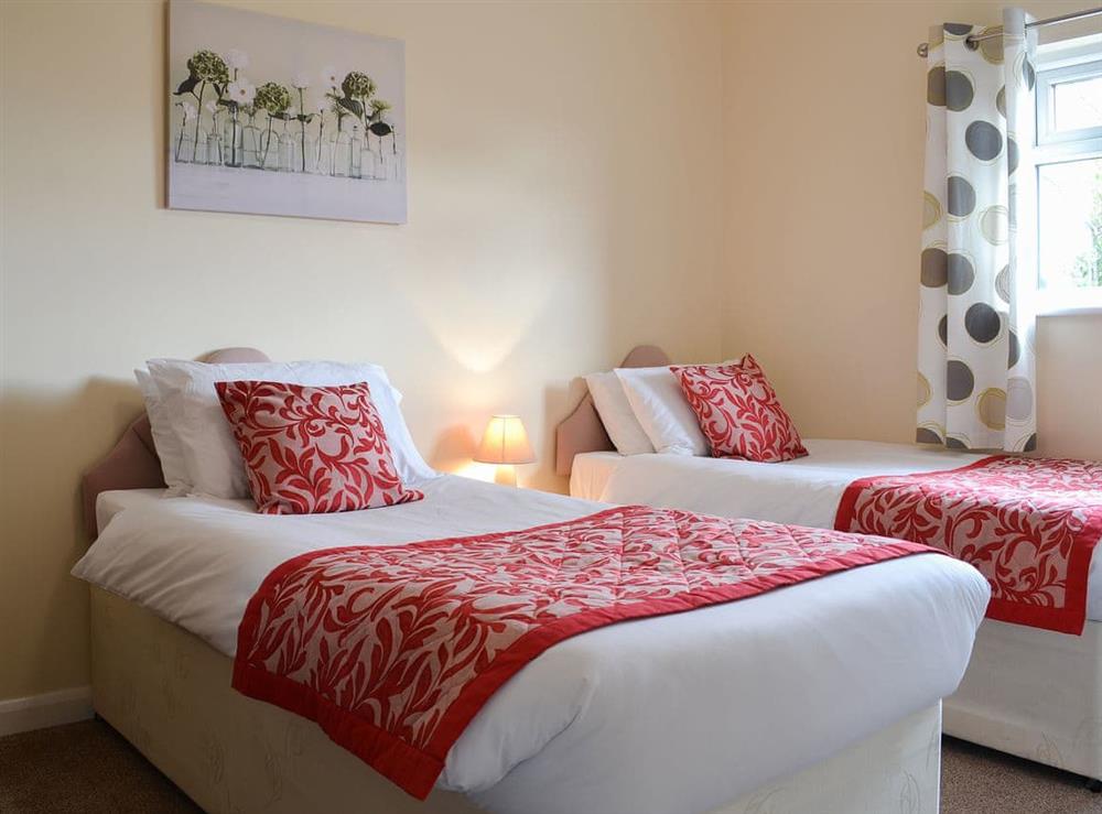 Welcoming twin bedded room at The Racecourse Lodge in Hexham, Northumberland