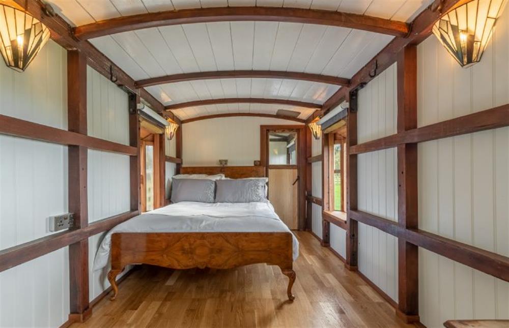 Ground floor: Sleep in a late Victorian walnut bed at The Railway Carriage, Melton Constable
