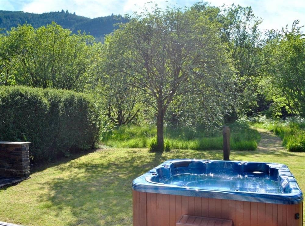Relaxing hot tub in garden at The Ranch in Glen Massan, near Dunoon, Argyll
