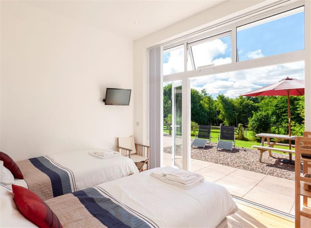 Relaxing twin bedroom with access to terrace at The Red Barn in , Braunton