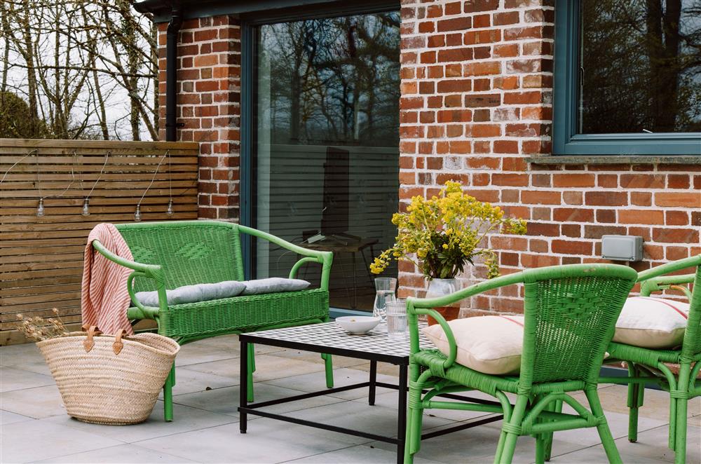 The patio area with outdoor seating is a perfect spot to sit back and unwind