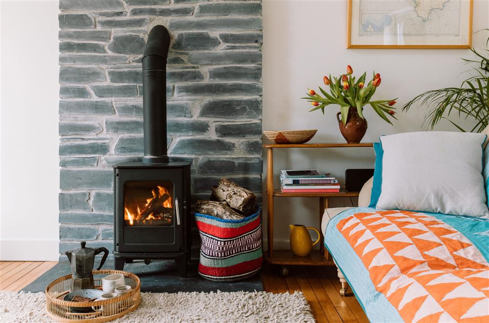 The sitting area with a cosy wood burning stove