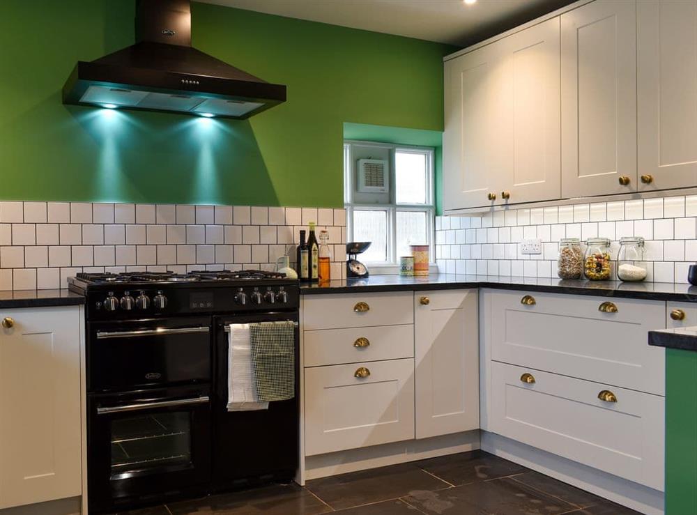 Modern fitted kitchen at The Retreat in Burton Bradstock, near Bridport, England