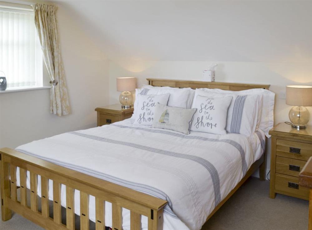 Relaxing double bedroom with en-suite shower room at The Retreat in Hunmanby, near Filey, North Yorkshire
