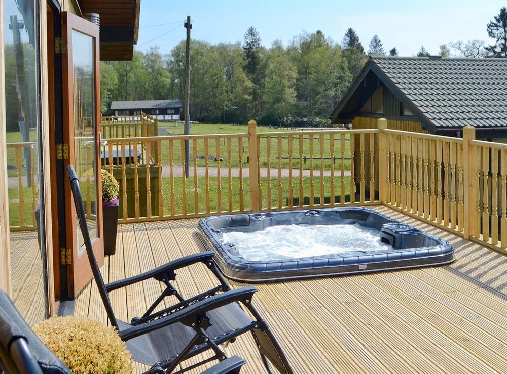 Relaxing 6 person hot tub on private decking at The Retreat in Otterburn, near Bellingham, Northumberland
