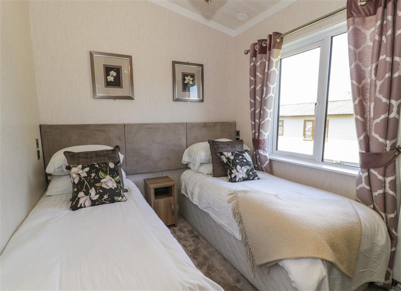 This is a bedroom at The Rivendale Lodge, Pwllheli