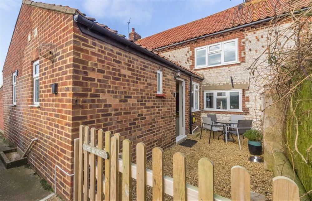 Enclosed courtyard garden and rear of cottage at The Roost, Titchwell near Kings Lynn