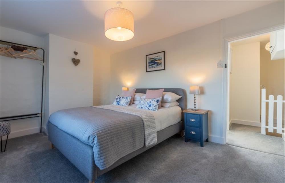 First floor: Master bedroom has comfortable double bed at The Roost, Titchwell near Kings Lynn
