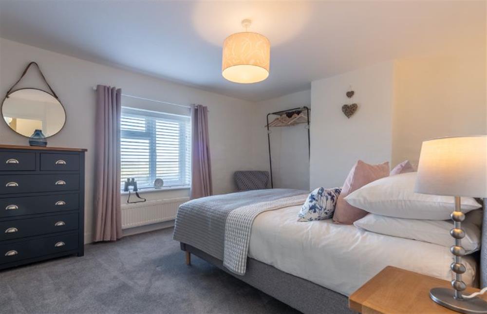 First floor: Master bedroom with views towards the sea at The Roost, Titchwell near Kings Lynn