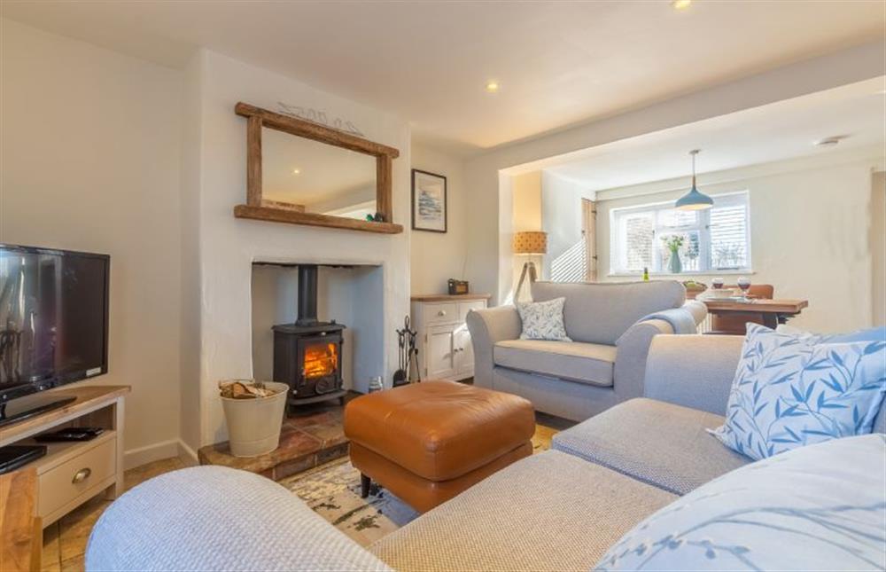 Ground floor: Sitting room with wood burning stove at The Roost, Titchwell near Kings Lynn