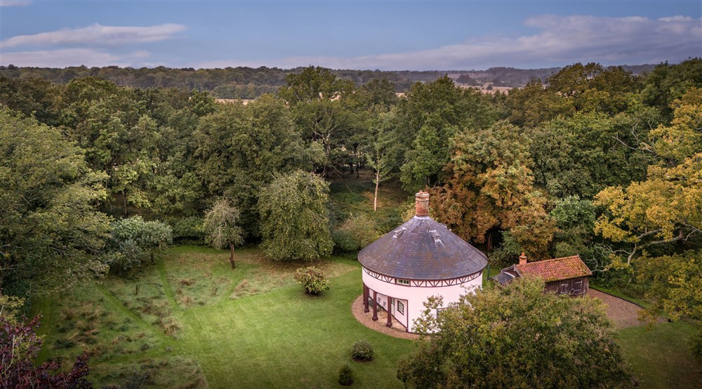 An aerial view of The Round House and its garden, in a woodland glade on the Ickworth Estate, Suffolk at The Round House in Bury St Edmunds, Suffolk
