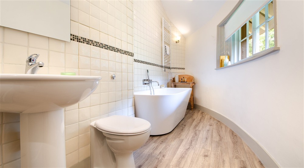 The en-suite bathroom with freestanding bath at The Round House in Bury St Edmunds, Suffolk