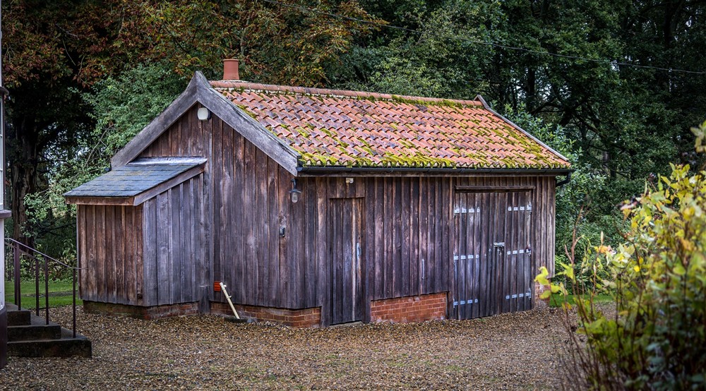 The outbuildings, storing the washing machine and tumble dryer, at The Round House in Bury St Edmunds, Suffolk