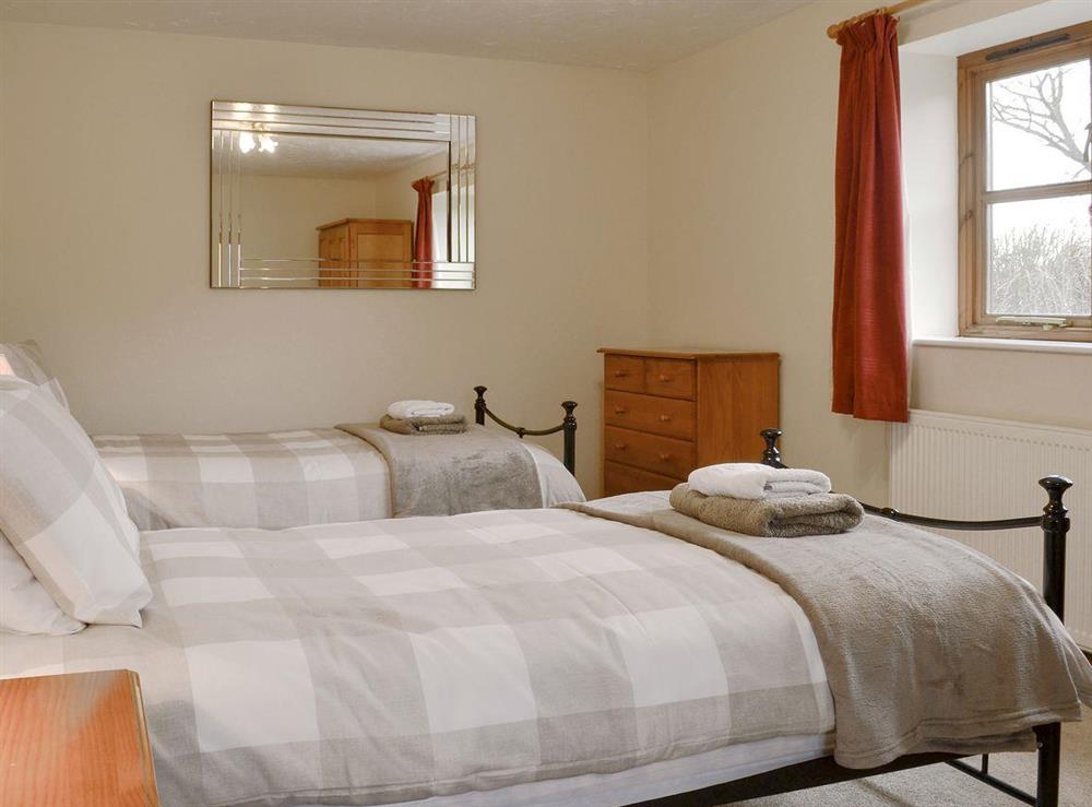 Comfortable twin bedroom at The Round House in Pyworthy, near Holsworthy, Devon