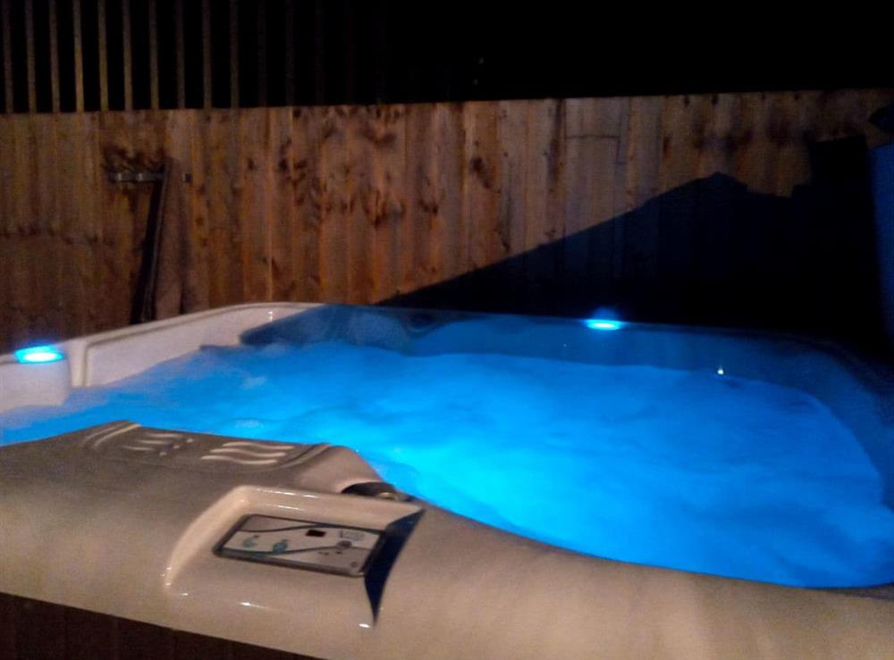 Stargaze at night in the relaxing hot tub at The Round House in Pyworthy, near Holsworthy, Devon