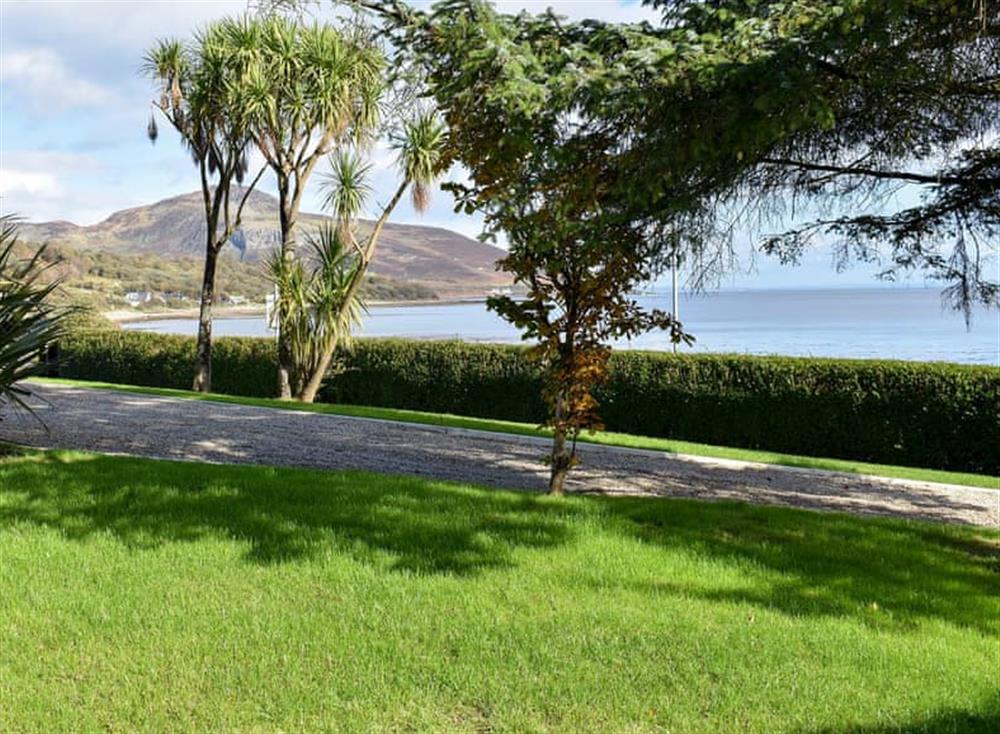 Large lawned garden with patio, garden furniture and BBQ (photo 2) at The Royal Arran in Whiting Bay, Isle Of Arran