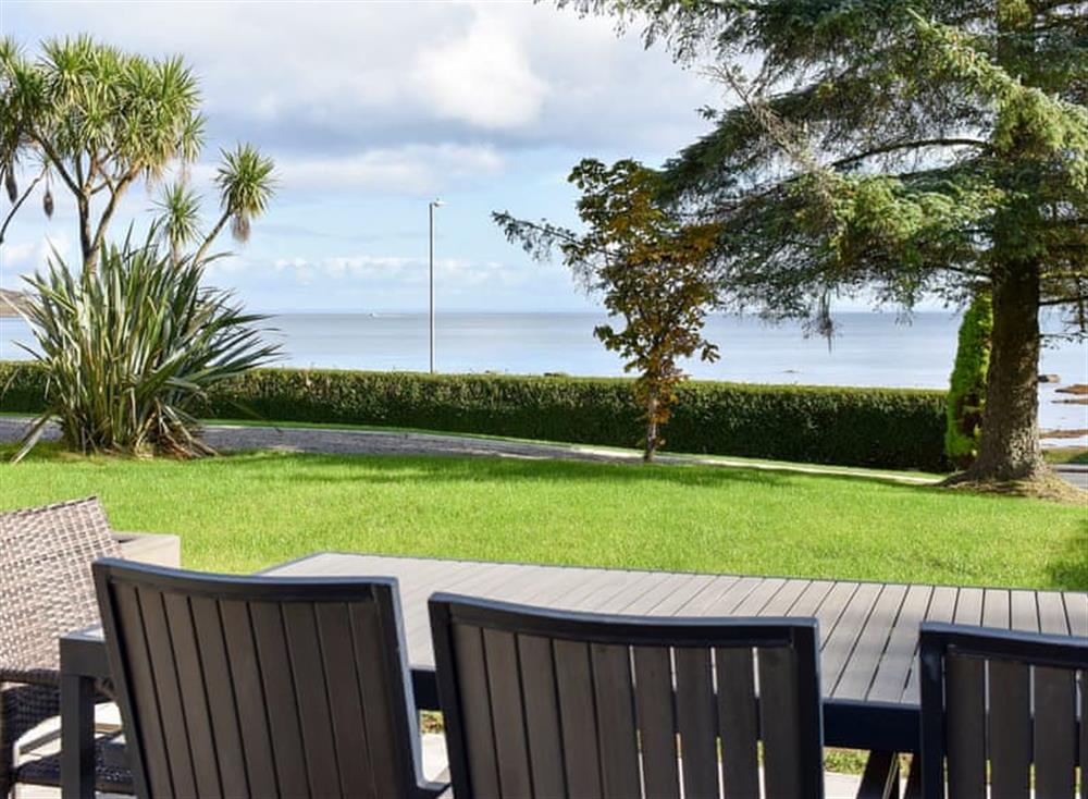 Large lawned garden with patio, garden furniture and BBQ at The Royal Arran in Whiting Bay, Isle Of Arran