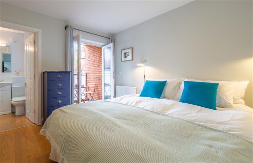 Master bedroom with private balcony and en-suite bathroom at The Sail Loft, Aldeburgh